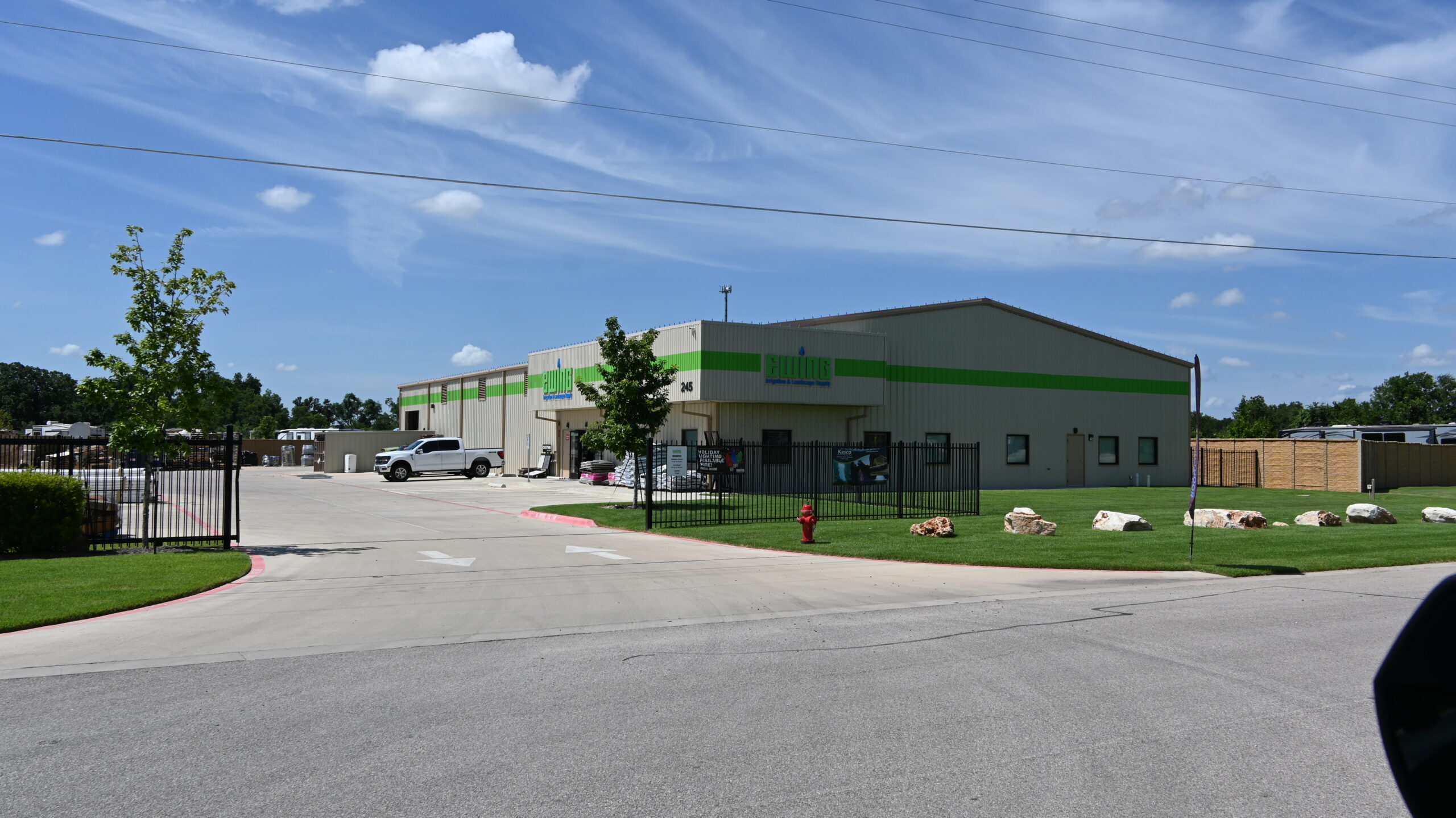 Green and Brown metal warehouse building leased and managed by JB Realty